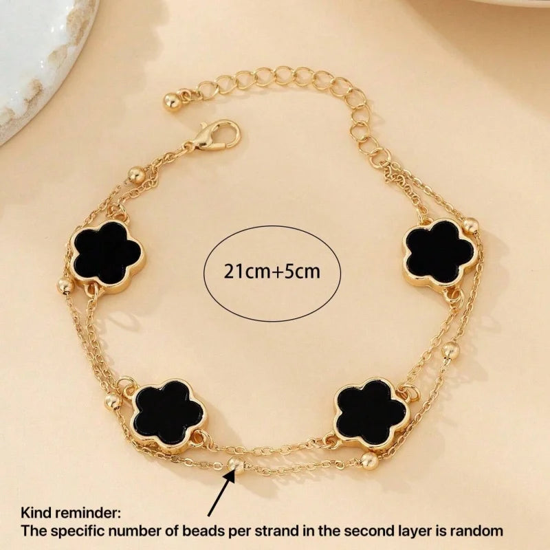 Gold five-leaf clover anklet featuring two layers of beads for summer jewelry