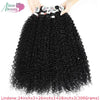 A bundle of long black curly hair extensions being held by a person.