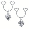 Silver heart dangle earrings with cubic zirconia stones and curved hoops