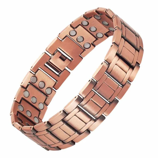 A close-up view of a copper magnetic bracelet set on a wrist.