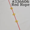 A red rope with gold accents, featuring a traditional Ethiopian head chain for women.