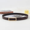A dark brown faux leather belt with a gold rectangular buckle is displayed on a white surface.