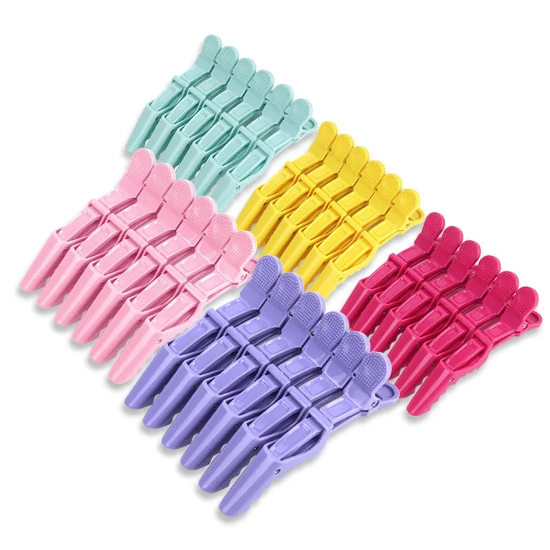 A set of six sturdy alligator hair sectioning clips in various pastel colors including mint green, yellow, pink, and purple.