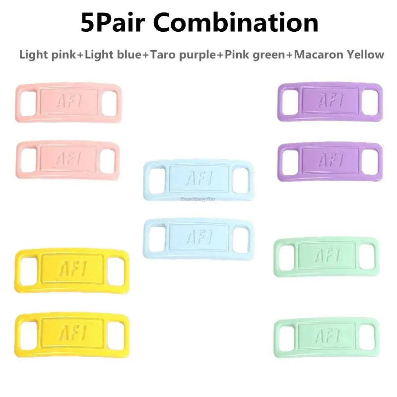 A set of five colored plastic shoe charms or laces in pink, blue, purple, green, and yellow.