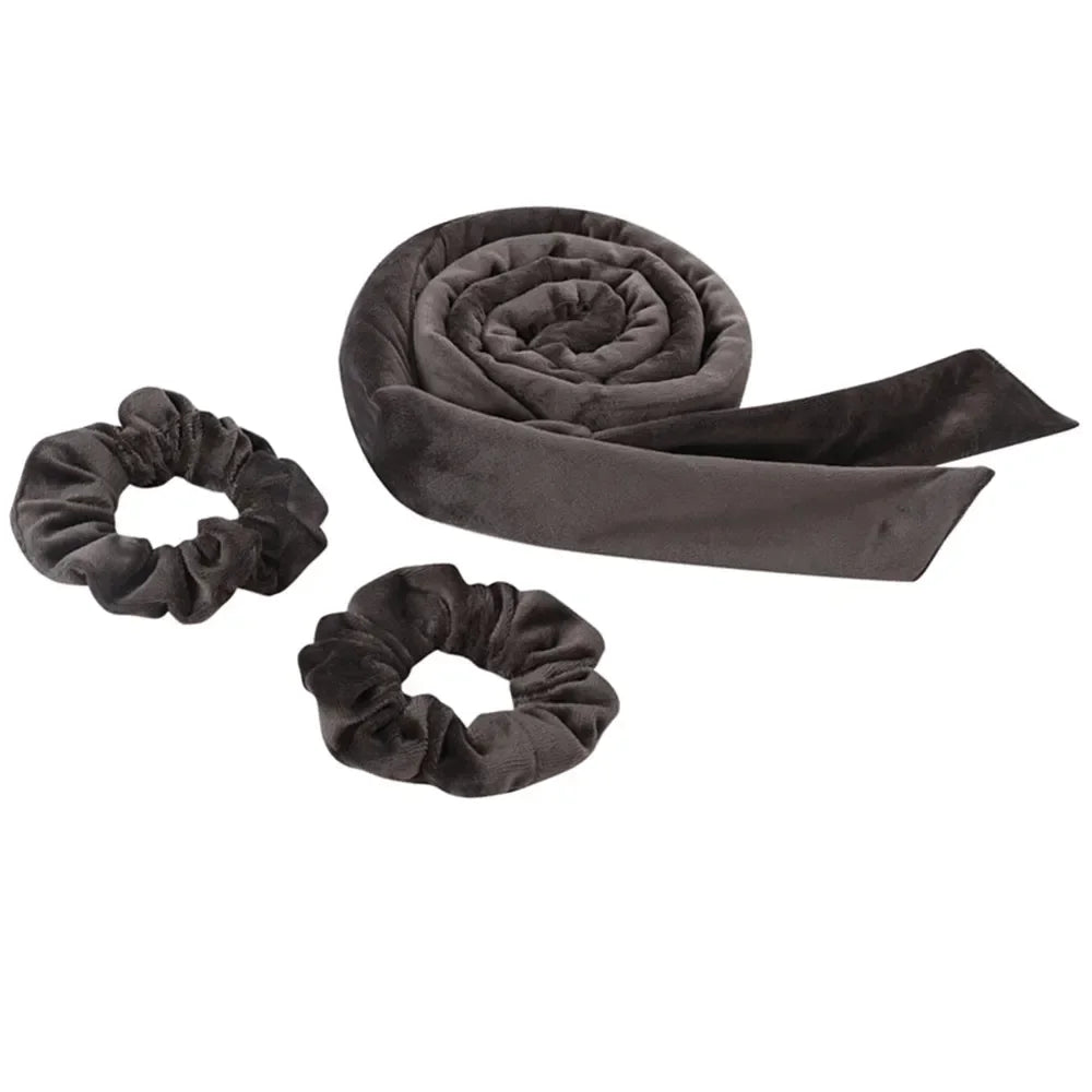Bandeau de fer à boucler pour cheveux en velours gris foncé, montré roulé et déroulé.