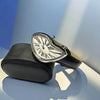 A silver-cased fashion quartz wristwatch with a Roman dial and leather strap resting on a black leather pouch.