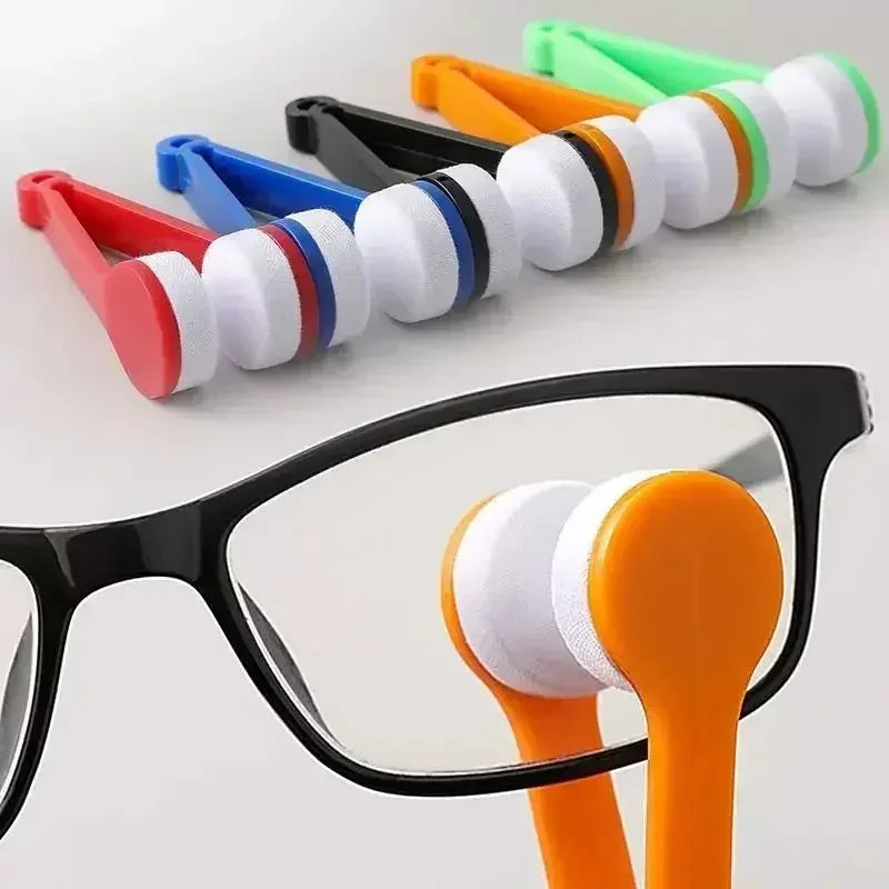 A portable multifunctional eyeglass cleaning kit showing various colored cleaning brushes and an orange brush on a pair of gl