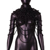 A black mannequin displays an imitation pearl statement necklace set with cascading strands.