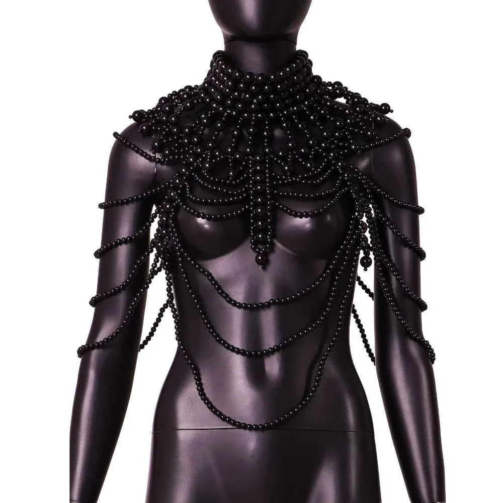 A black mannequin displays an imitation pearl statement necklace set with cascading strands.