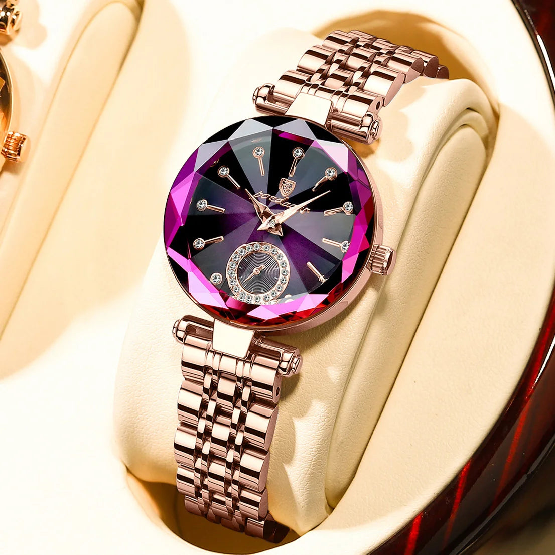 A close-up of an elegant stainless steel quartz ladies wristwatch with a purple and black face set against a light background