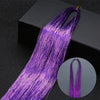 Purple glitter hair extensions strands displayed against a dark background.