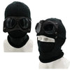Black knit windproof hat with round goggles displayed on a white mannequin.