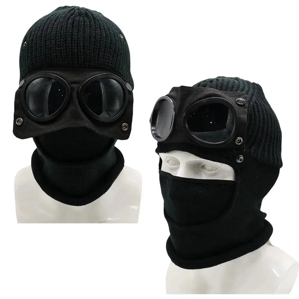 Black knit windproof hat with round goggles displayed on a white mannequin.