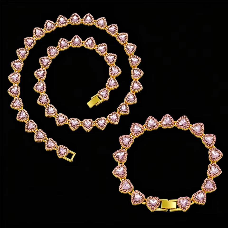 Gold-toned necklace and bracelet set featuring pink heart-shaped rhinestones