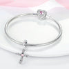 Sterling silver devil's eye charm bracelet with a heart pendant displayed on a white background.
