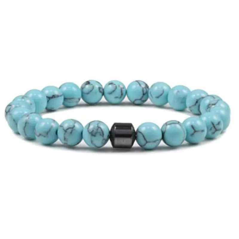 A bracelet made of light blue and green tiger eye lava map beads.