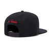 Black unisex adjustable snapback cap with red embroidered text on the front