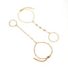 A delicate gold-plated bracelet featuring multiple linked chains and circular charms.