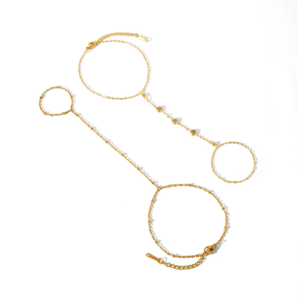 A delicate gold-plated bracelet featuring multiple linked chains and circular charms.