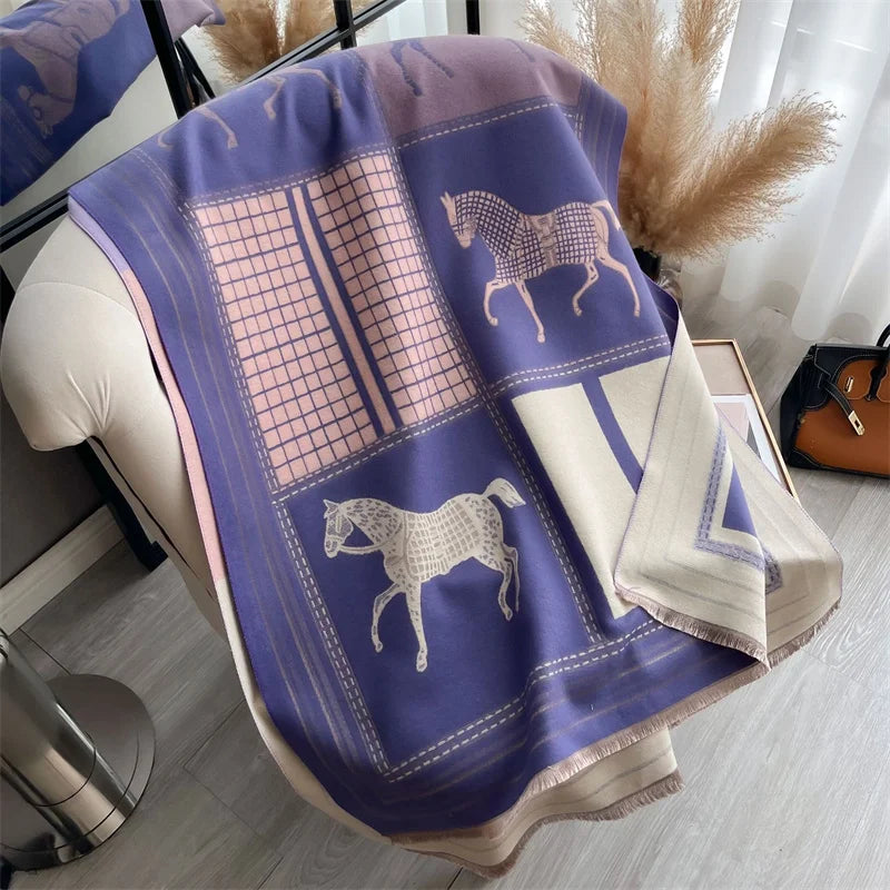 A purple and beige plaid cashmere feel scarf draped over a light-colored surface.