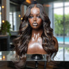 A model wearing an HD Ombre Honey Blonde Wavy Lace Front Wig with long, dark brown hair.