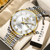 A gold and silver wind-up watch with a leather strap is displayed on a light background.