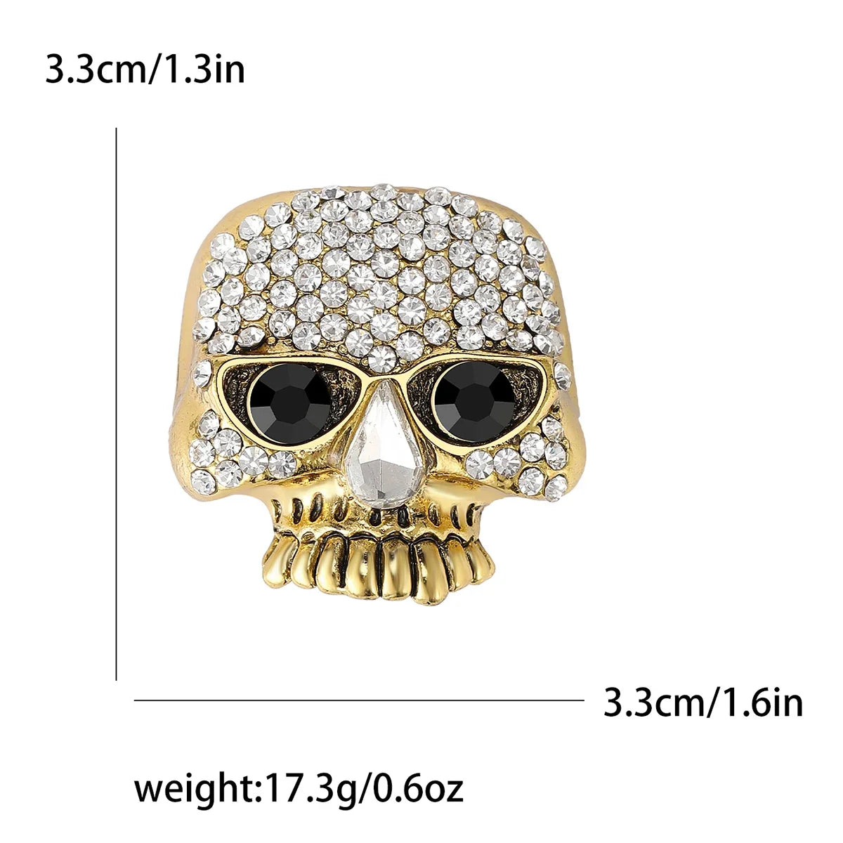 Broche calavera de straso dorado con detalle de cráneo.