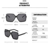 A set of black fashion oversized gradient sunglasses with a thin frame and dark lenses.