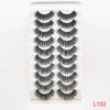 A set of dramatic mink false eyelashes displayed in a clear packaging.