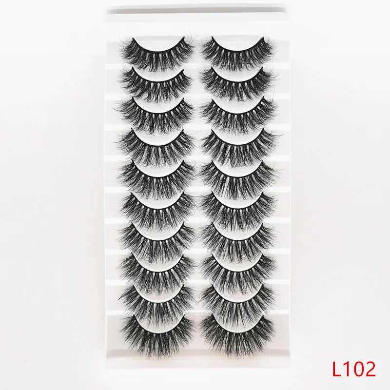 A set of dramatic mink false eyelashes displayed in a clear packaging.
