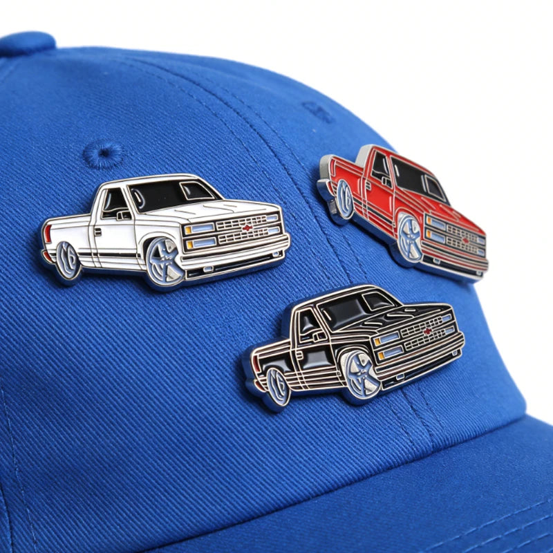 Blue baseball cap featuring metal clip pins of retro Mexico style vehicles