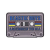 A rectangular enamel pin featuring the text BEASTIE BOYS LICENSED TO ILL in blue and yellow lettering on a gray background.