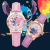 A pink wrist watch featuring a Stitch cartoon design on the dial and a matching pink strap, set against a dark background wit