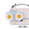 Light blue and white daisy-themed pouch for portable eyewear storage