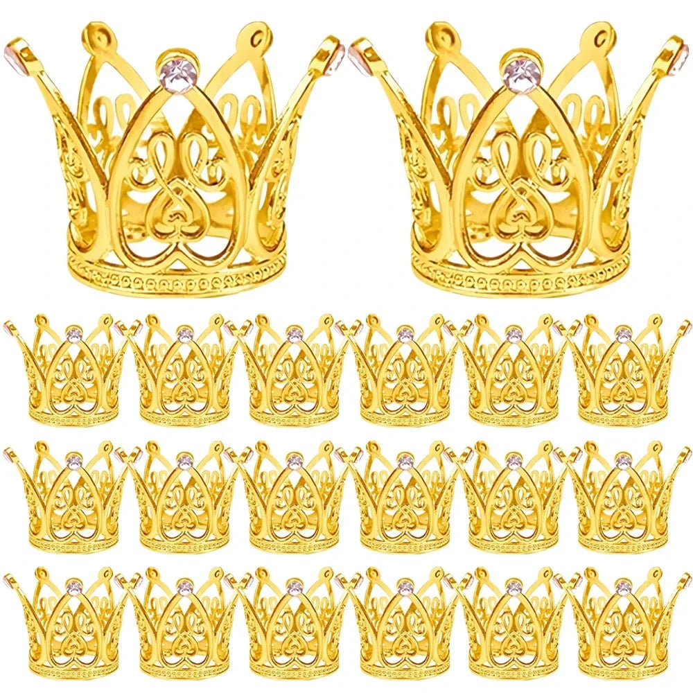 A collection of gold and silver mini crown cake toppers for parties.