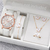 A silver-toned fashion quartz wristwatch with a leather strap is displayed inside an open white box.