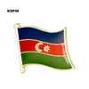 A lapel pin badge featuring the flag of a country with horizontal stripes of blue, red, and green, and a crescent and star sy