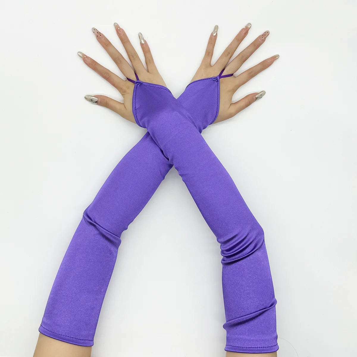 Purple satin fingerless gloves crossed in an X shape against a white background