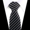 Black and white striped silk necktie worn against a white shirt.