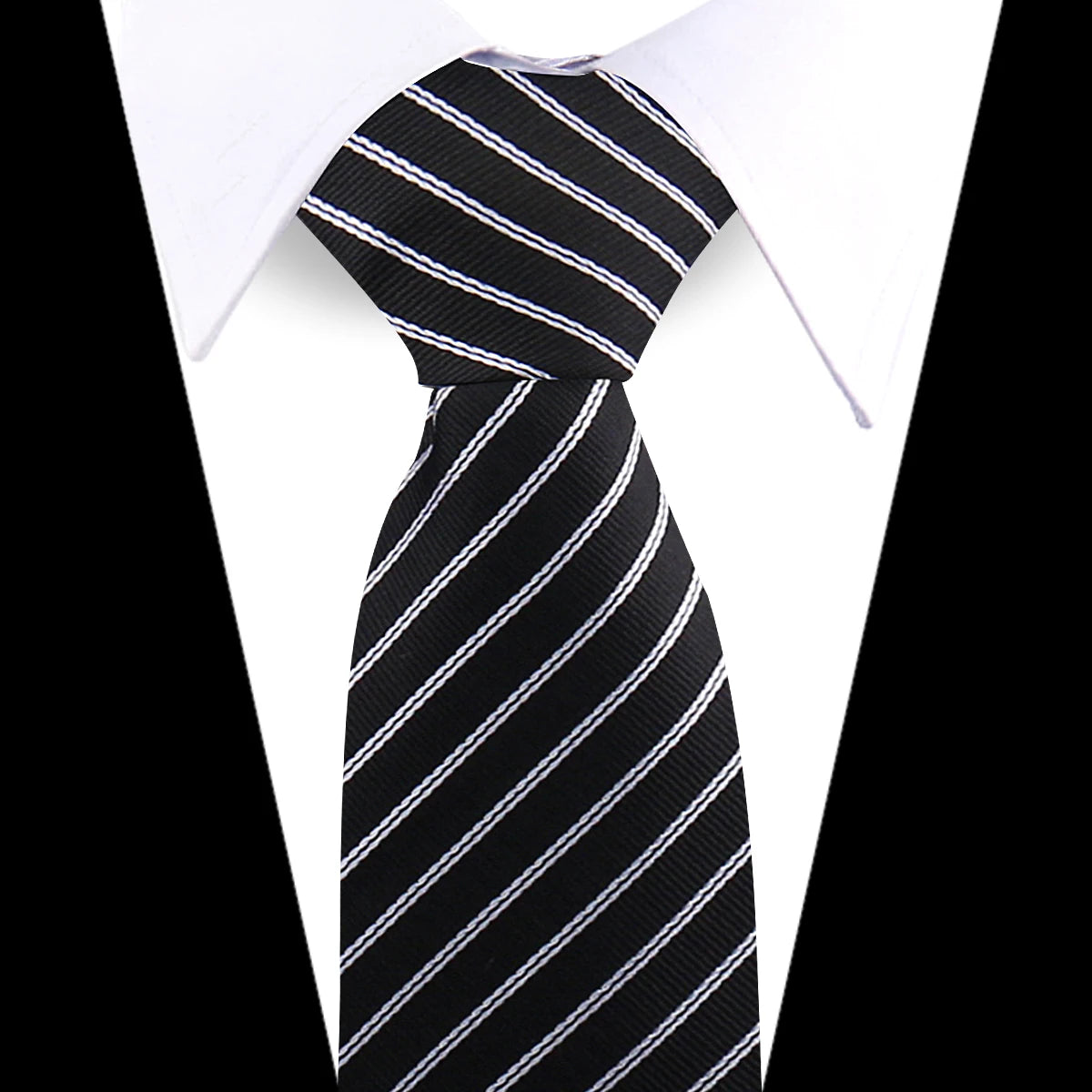 Black and white striped silk necktie worn against a white shirt.