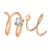 Aros de nariz dobles con tono dorado, con piedra de circonita cúbica clara y un dije de estrella.