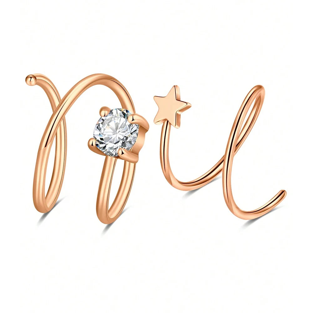 Aros de nariz dobles con tono dorado, con piedra de circonita cúbica clara y un dije de estrella.