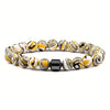A bracelet made of tiger eye lava map beads with black and yellow swirling patterns.