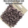 A pile of dark gray satin hair scrunchies displayed on a cardboard backing.