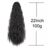 A long, black synthetic kinky curly ponytail hair extension with a measuring line.
