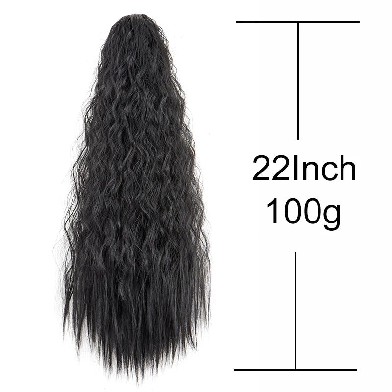 A long, black synthetic kinky curly ponytail hair extension with a measuring line.