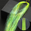 A long, bright lime green hair extension with fine strands is displayed against a dark background.