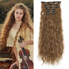 Long, wavy brown synthetic hair extensions with 16 clips, measuring 22 inches.