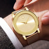 A close-up of a gold-toned quartz wristwatch with a white face and a rose gold mesh strap worn on a wrist.