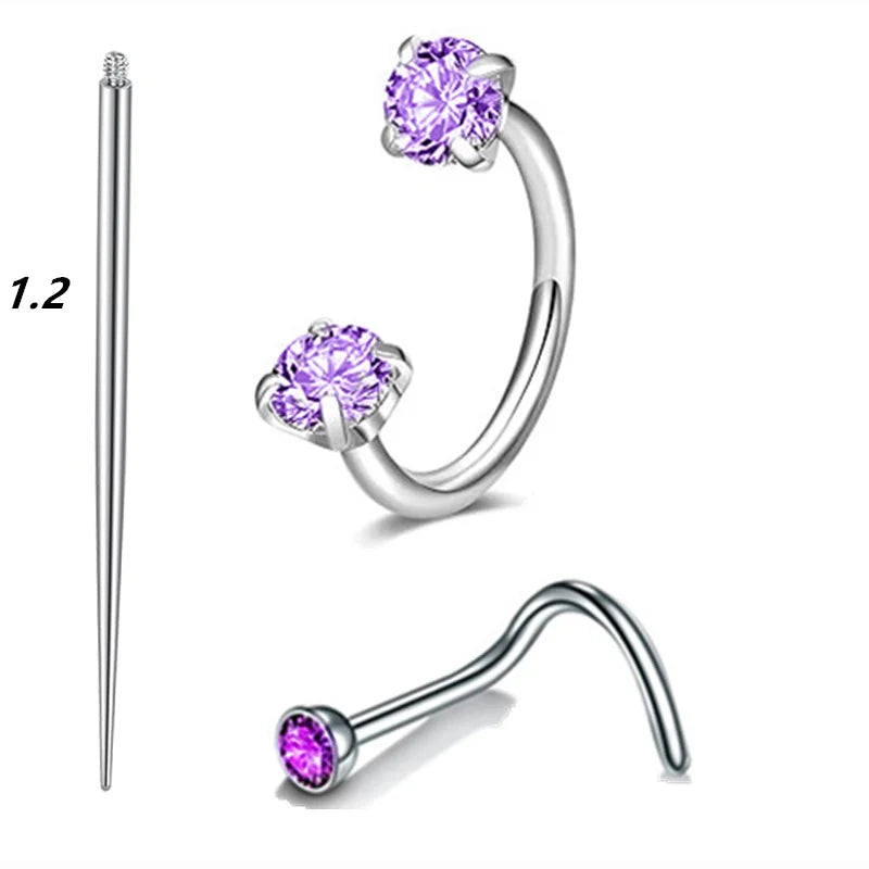 A set of silver horseshoe nose rings and a straight nose ring with a stud.